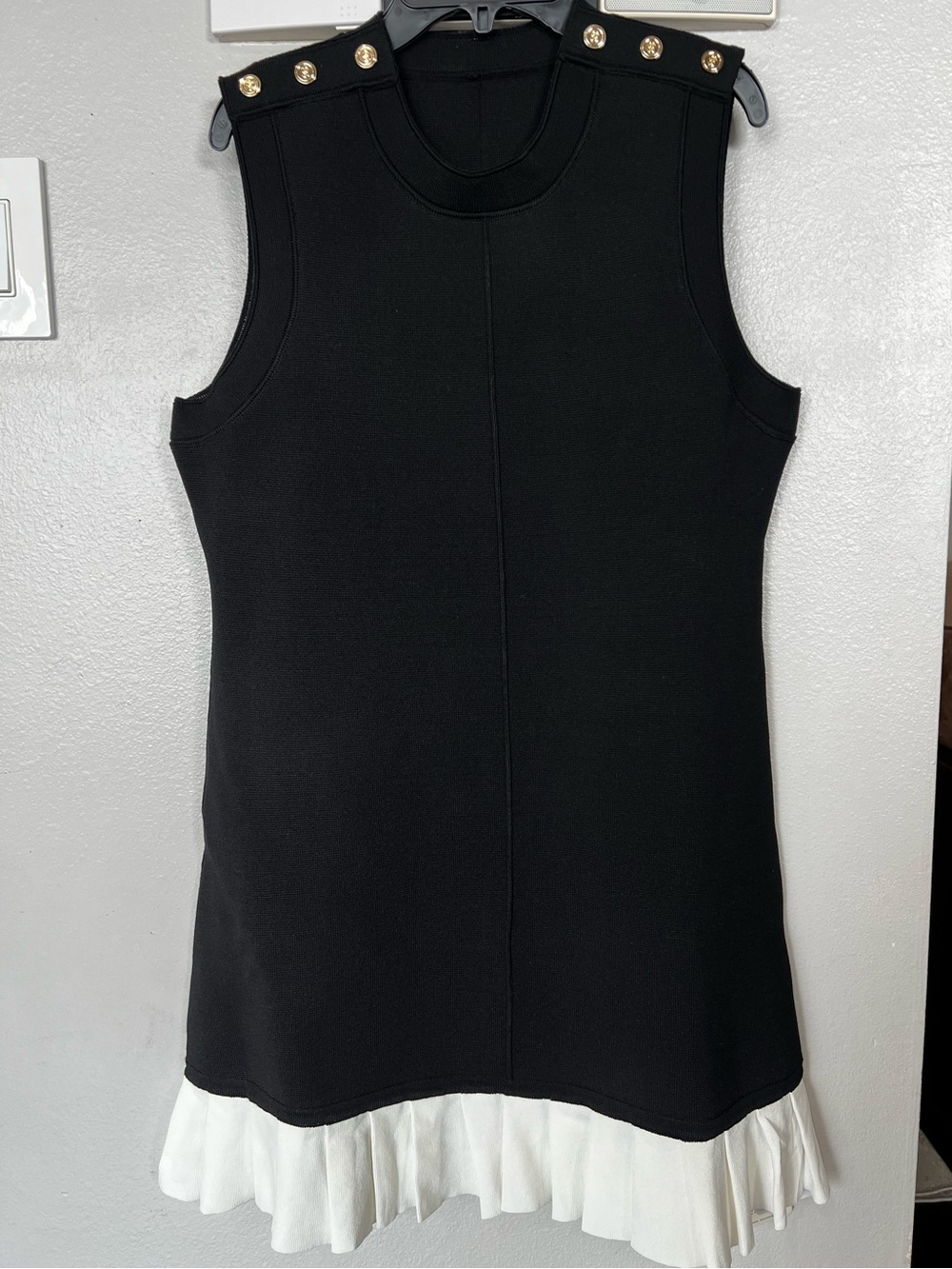 Black Sleeveless Dress with White Ruffle Hem